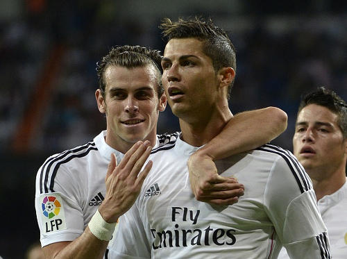 Photo: Real Madrid star Cristiano Ronaldo (centre) is congratulated by world record signing Gareth Bale. Bale once blocked John Bostock's path to the first team at Tottenham Hotspur.