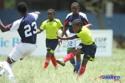 Photo: Trendsetter Hawks Under-11 attacker Quddoos Abdul Hypolite shoots for goal against the Santa Cruz Under-13s during 2015 Republic Bank National Youth Cup action at the Queen's Park Savannah. (Courtesy Allan V Crane/Wired868)