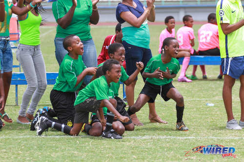 Photo: Uprising Youths substitutes get excited as their team clinches the Republic Bank 2015 National Youth Cup Under-11 crown at the Larry Gomes Stadium in Malabar. (Courtesy Sinead Peters/Wired868)