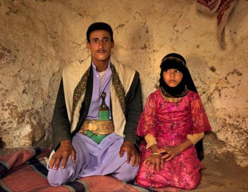 Photo: Majed, 25, (left) and his eight year old child bride, Ghana, in Yemen. (Copyright ABC News)