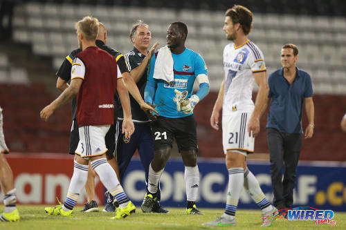 Photo: LA Galaxy coach Bruce Arena (centre) congratulates Central FC custodian Jan-Michael Williams, after their 1-1 tie in CONCACAF Champions League action in August 2015. Coaches are at the centre of the action in virtually all American professional sport. (Courtesy Allan V Crane/Wired868)