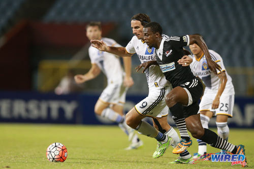 Photo: Then Central FC attacker Marcus Joseph (right) and LA Galaxy striker Allan Gordon chase the ball during CONCACAF Champions League action in August 2015. (Courtesy Allan V Crane/Wired868)