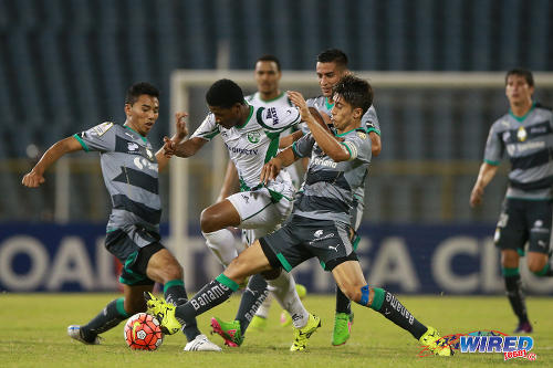 Photo: W Connection winger and former Trinidad and Tobago National Under-20 player Aikim Andrews (centre) tries to find way past a gang of Santos Laguna players during 2015/16 CONCACAF Champions League action at the Hasely Crawford Stadium in Port of Spain. (Courtesy Allan V Crane/Wired868)