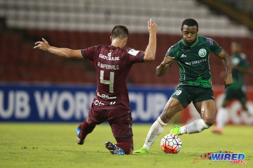 Photo: W Connection attacker Jomal Williams (right) dances around Deportivo Saprissa defender Andres Imperiale during 2015 CONCACAF Champions League action. (Courtesy Allan V Crane/Wired868)