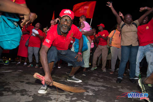 Photo: Whaddap, cocoyea! A PNM supporter celebrates at Balisier House after the election results on September 7, 2015. (Courtesy Allan V Crane/Wired868)