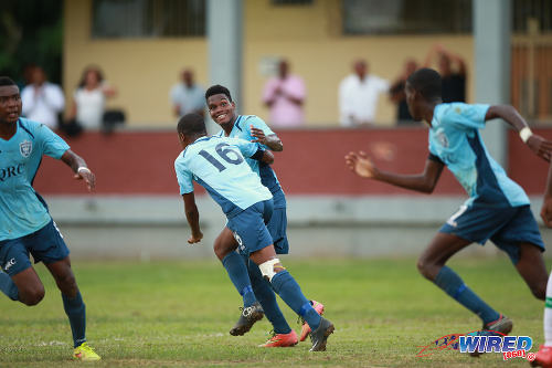 Photo: QRC midfielder Demetri Dunkley (centre) sprints off with his teammates after his goal against St Augustine Secondary in the 2015 SSFL season. (Courtesy Allan V Crane/Wired868)