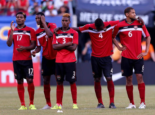 Photo: Trinidad and Tobago players (from left) Mekeil Williams, Ataulla Guerra, Joevin Jones, Sheldon Bateau and Radanfah Abu Bakr look on during their penalty shoot out with Panama at the 2015 CONCACAF Gold Cup. (Copyright AFP 2015)