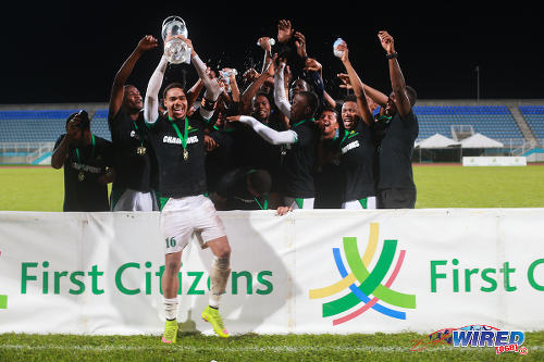 Photo: W Connection captain Alvin Jones lifts the 2015 First Citizens Cup trophy with his teammates, after they edged Central FC 2-1 at the Ato Boldon Stadium, Couva. (Courtesy Allan V Crane/Wired868)