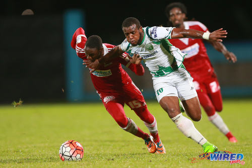 Photo: W Connection attacker Jomal Williams (right) drives past Central FC defender Kaydion Gabriel during the 2015 First Citizens Cup final in Couva. (Courtesy Allan V Crane/Wired868)