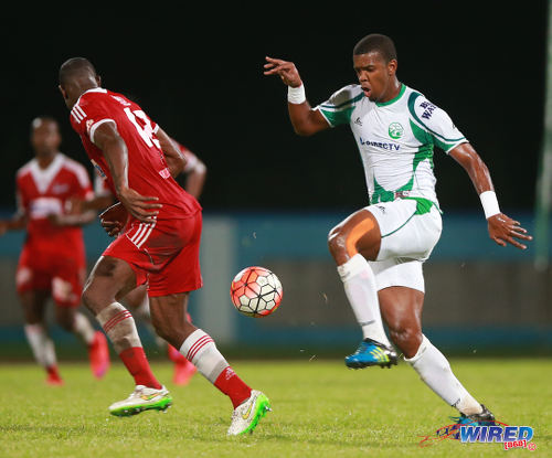 Photo: W Connection substitute Dwight Quintero (right) takes on Central FC defender Jamal Jack during the 2015 First Citizens Cup final. (Courtesy Allan V Crane/Wired868)