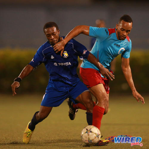 Photo: FC Santa Rosa midfielder Durwin Ross and Marabella Family Crisis Centre winger Dwayne Edwards fight for possession during 2015/16 CNG NSL action in Macoya. (Courtesy Allan V Crane/Wired868)