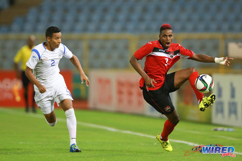 Photo: Trinidad and Tobago winger Joevin Jones (right) takes on Nicaragua right back Joseue Quijano during friendly action at the Hasely Crawford Stadium on 13 October 2015. (Courtesy Allan V Crane/Wired868)