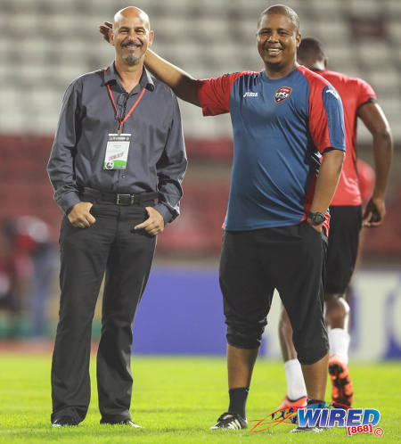 Photo: Trinidad and Tobago National Senior Team coach Stephen Hart (left) enjoys a light moment with assistant coach Derek King before kick off against Nicaragua on13 October 2015 in Port of Spain. (Courtesy Allan V Crane/Wired868)