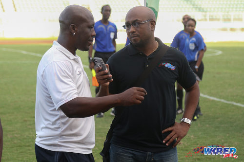 Photo: Guaya United co-coach Akeno Morgan (left) talks about the CNG 2015 National Super League KO final with Wired868 director Lasana Liburd. (Courtesy Chevaughn Christopher/Wired868)