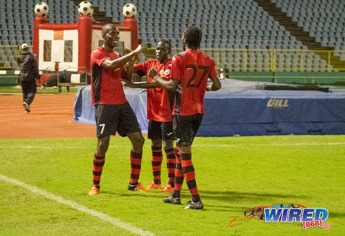 Photo: San Juan Jabloteh players (from left) Jamal Gay, Fabian Reid and Nathan Lewis celebrate a goal against Guaya United in the 2015 Toyota Classic quarterfinal round at the Hasely Crawford Stadium. (Courtesy Amigo Garraway/Wired868)