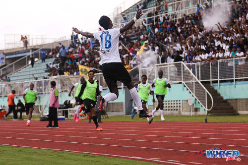 Photo: Naparima College forward Isaiah Hudson leaps into the air to celebrate his goal against Presentation College (San Fernando) in the South Zone Intercol final at the Mannie Ramjohn Stadium, Marabella. (Courtesy Chevaughn Christopher/Wired868)