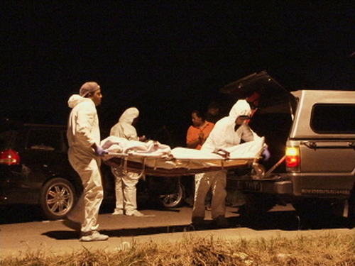 Photo: Another lifeless body heads to the morgue.