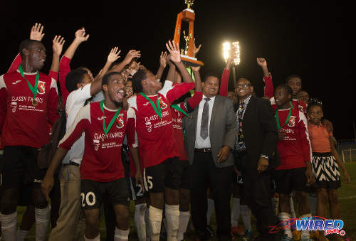 Photo: Sport Minister and ex-St Mary's College football captain Darryl Smith (centre) and SSFL president Anthony Creed (fourth from right) congratulate 2015 North Zone Intercol champs, St Anthony's College. (Courtesy Nicholas Bhajan/Wired868)