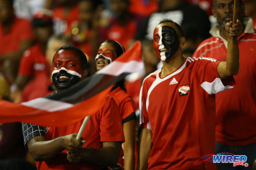 Photo: Trinidad and Tobago football fans get behind their team at the Hasely Crawford Stadium, during their World Cup qualifying clash with the United States on 17 November 2015. (Courtesy Allan V Crane/Wired868)