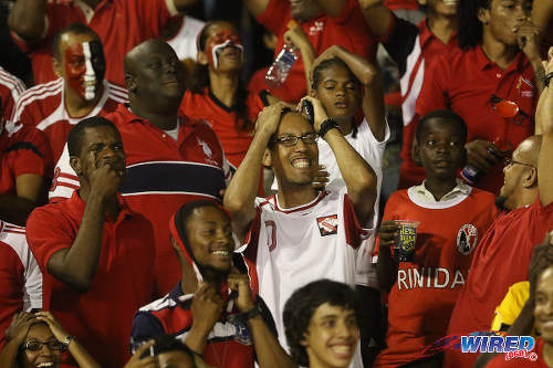 Photo: Trinidad and Tobago football fans react to action during their team's goalless draw with the United States yesterday in 2018 World Cup qualifying action at the Hasely Crawford Stadium in Port of Spain. (Courtesy Chevaughn Christopher/Wired868)