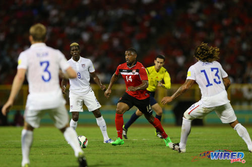 Photo: Trinidad and Tobago midfielder Andre Boucaud (centre) looks for passing options under close watch from US players (from right) Jermaine Jones, Gyasi Zardes and Tim Ream during 2018 World Cup qualifying action at the Hasely Crawford Stadium on 17 November 2015. (Courtesy Allan V Crane/Wired868)