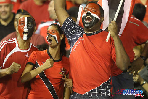 Photo: Football fans (from left) Peter Cumberbatch, Alana Lewis and Eugene Todd answer the call to get behind the "Soca Warriors" against the United States on 17 November 2015. (Courtesy Chevaughn Christopher/Wired868)