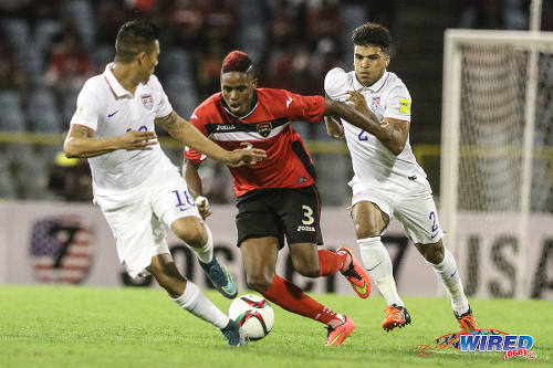 Photo: Trinidad and Tobago winger Joevin Jones (centre) terrorises United States players DeAndre Yedlin (right) and Michael Orozco during Russia 2018 World Cup qualifying action at the Hasely Crawford Stadium in Port of Spain. (Courtesy Chevaughn Christopher/Wired868)