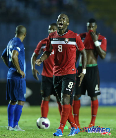 Photo: Trinidad and Tobago midfielder Khaleem Hyland (centre) roars during Russia 2018 World Cup qualifying action in Guatemala City on 13 November 2015. Hyland scored in a 2-1 win for the "Soca Warriors." (Courtesy Allan V Crane/Wired868)