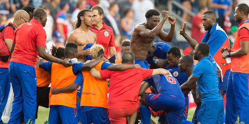 Photo: The Haiti football team celebrate after their 1-0 triumph over Honduras during the 2015 Gold Cup tournament. (Courtesy MexSport/CONCACAF)