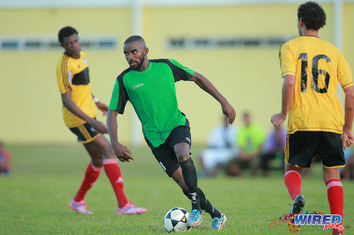 Photo: Prisons FC winger Ricardo Alleyne (centre) in 2015 CNG National Super League (NSL) Championship Division action against Cunupia FC at YTC, Arouca. (Courtesy Allan V Crane/Wired868)