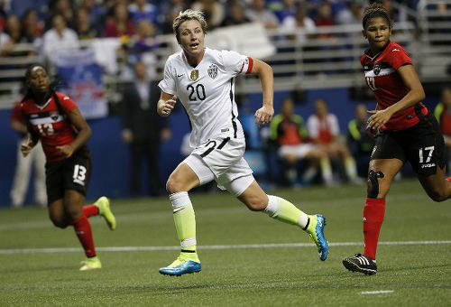 Photo: United States record goal scorer Abby Wambach (centre) tries to sniff out an opportunity while Trinidad and Tobago defender Victoria Swift (right) keeps watch during international friendly action in San Antonio on Friday 11 December 2016. (Copyright AFP 2015/Chris Covatta)