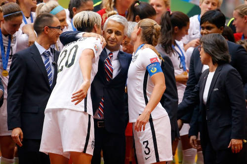 Photo: United States Soccer Federation (USSF) president Sunil Gulati (centre) hugs national women players Abby Wambach (left) and Christie Rampone after their 2015 World Cup final win over Japan. (Copyright AFP 2015/Kevin C Cox)