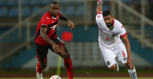 Photo: Trinidad and Tobago midfielder Khaleem Hyland (left) chases Panama midfielder Gabriel Gomez during international friendly action in Couva. (Copyright CONCACAF)