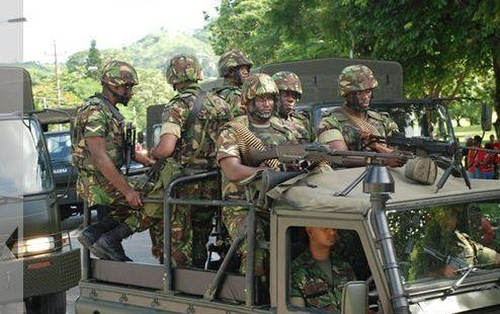 Photo: Trinidad and Tobago soldiers on the move during joint patrols with the police. (Copyright Baltimore Examiner)