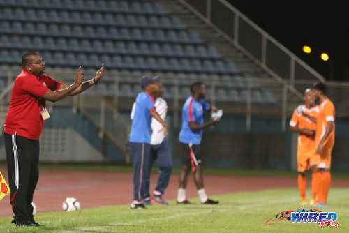 Photo: Morvant Caledonia United coach Rajesh Latchoo (far left) gives instructions during 2015/16 Pro League clash with Club Sando at the Ato Boldon Stadium, Couva. Latchoo was promoted from assistant to head coach for the 2016/17 season. (Courtesy Chevaughn Christopher/Wired868)