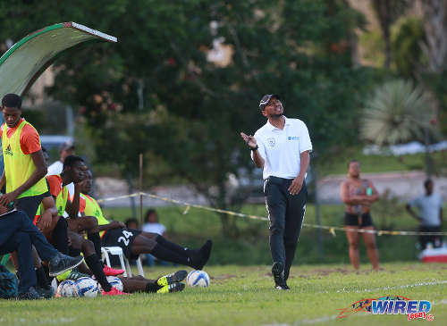 Photo: Real Maracas coach Michael McComie (right) gestures on the sidelines during 2015/16 CNG NSL Premiership action against Stokely Vale at the Maracas Recreation Ground. (Courtesy Nicholas Bhajan/Wired868)