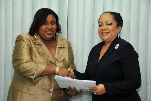 Photo: Housing Minister Marlene McDonald (left) during her prior stint in the Ministry of Community Development, Culture and Gender Affairs. (Copyright news.gov.tt)