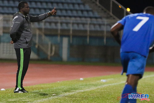 Photo: Police FC coach Richard Hood gestures from the sidelines during 2015/16 Pro League action against San Juan Jabloteh. (Courtesy Chevaughn Christopher/Wired868)