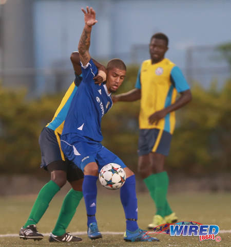 Photo: FC Santa Rosa forward Rashad Griffith (centre) tries to hold off a Club Sando Moruga defender during 2015/16 National Super League (NSL) Premiership Division action at the Marvin Lee Stadium in Macoya. (Courtesy Nicholas Bhajan/Wired868)