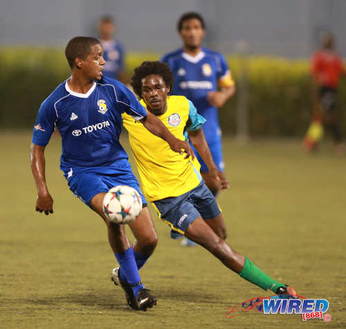 Photo: FC Santa Rosa midfielder Shaka Pilgrim (left) tries to keep the ball away from Club Sando Moruga midfielder Kyle Morgan during 2015/16 CNG National Super League (NSL) Premiership Division action at the Marvin Lee Stadium in Macoya. (Courtesy Nicholas Bhajan/Wired868)