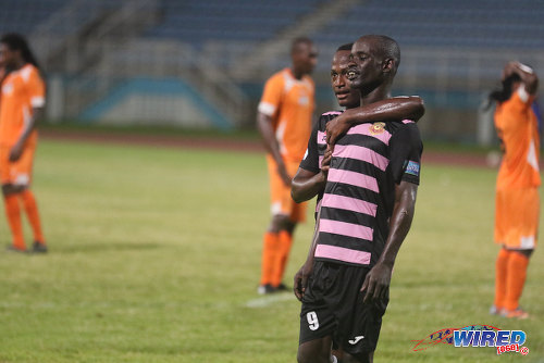 Photo: North East Stars striker Gorean "Ratty" Highley is congratulated by a teammate after his decisive goal against Club Sando in 2015/16 Pro League action in Couva. (Courtesy Chevaughn Christopher/Wired868)