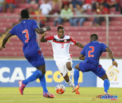 Photo: Trinidad and Tobago winger Joevin Jones (centre) tries to find a way past Haiti defenders Stéphane Lambèse (right) and Méchack Jérome during the 2016 Copa America play off contest at the Rommel Fernandez Stadium, Panama City.  (Courtesy Allan V Crane/CA-images/Wired868)