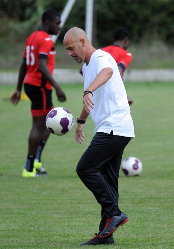 Photo: Trinidad and Tobago head coach Stephen Hart juggles a football during practice before his team's 2016 Copa America play off contest against Haiti. (Copyright AFP 2016)