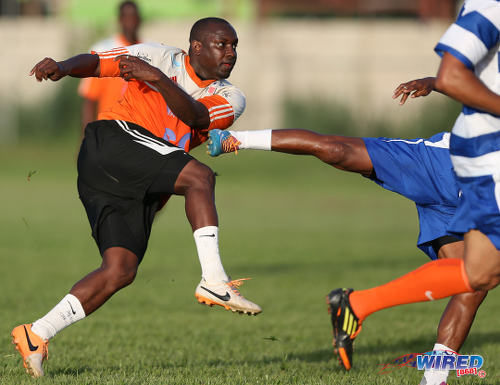 Photo: Darin Lewis (left) drives towards goal during the 4th Annual Wired868 Football Festival at UWI SPEC Grounds, St Augustine.  (Courtesy Allan V Crane/CA-images/Wired868)