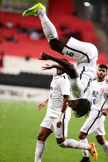 Photo: Trinidad and Tobago forward Kenwyne Jones celebrates a goal for UAE club, Al Jazira, against Al Saad with a trademark somersault during AFC Champions League play off action on 9 February 2016. (Courtesy KJ Media)