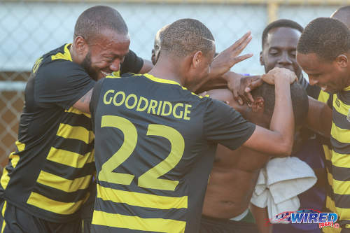 Photo: Defence Force players celebrate a Christon Baptiste item against Stokely Vale during NSL Premiership Division action against Stokely Vale FC on 21 February 2016 in Macoya. (Courtesy Nicholas Bhajan/Wired868)