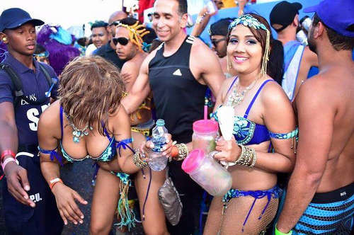 Photo: Attorney general Faris Al-Rawi (centre) enjoys himself during the 2016 Carnival celebrations.