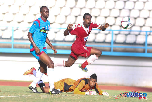 Photo: Central FC attacker Marcus Joseph (centre) scores the game winner on 20 February 2016 while St Ann's Rangers defender Shakiyl Phillip (left) and goalkeeper Christopher Biggette watch on. (Courtesy Chevaughn Christopher/Wired868)