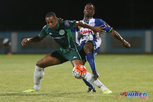 Photo: W Connection midfielder Briel Thomas (left) holds off Club Sportif Moulien midfielder Willis Francillonne during 2016 Caribbean Club Championship action in Couva on 26 February 2016. (Courtesy Chevaughn Christopher/Wired868)