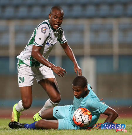 Photo: W Connection forward Jamal Charles (left) takes on an Atlantico FC defender during Caribbean Club Championship action in Couva on 24 February 2016/ (Courtesy Allan V. Crane/CA-images.